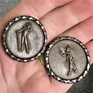 Two Fops buttons with leather backgrounds and cut-steel rims of Incroyable and Merveilleuse.