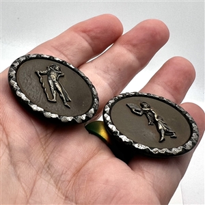 Two Fops buttons with leather backgrounds and cut-steel rims of Incroyable and Merveilleuse.