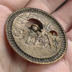 “Bazaar - button of two robed figures in an Eastern bazaar.