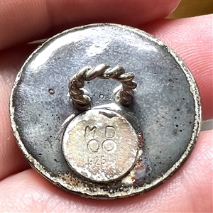 Sculptural gilded silver button of a snake with enamel background.