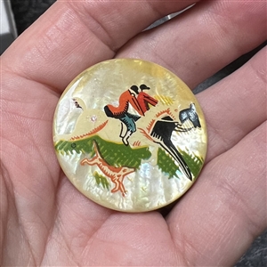 Painted pearl button two hunters on horseback with dog.