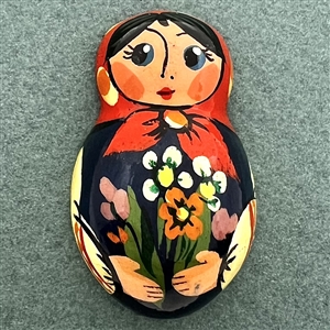 Russian lacquer button of a realistic Matryoshka doll.