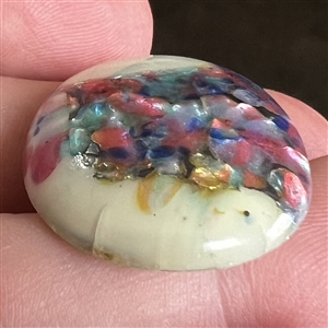 Oval glass button by Leo Popper.