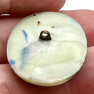 Oval glass button by Leo Popper.