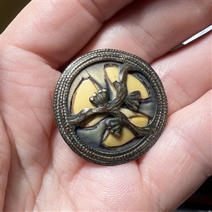 Arts and Crafts button of floral theme.