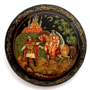 Russian lacquer button of a man leading a woman on a horse in front of a castle at night. 