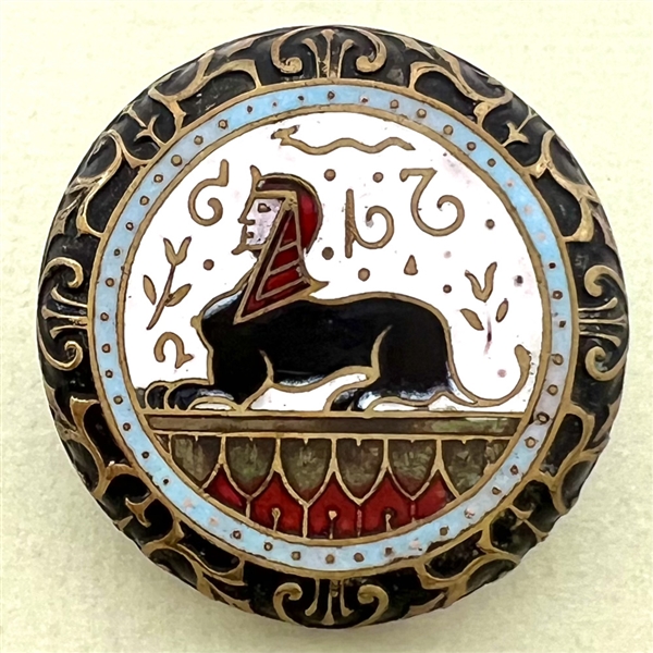 Large enamel button of Egyptian sphinx.