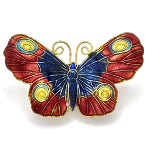 Cold enamel button of a realistic butterfly.
