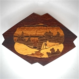 Marquetry wood button of a cabin or a smoking volcano.