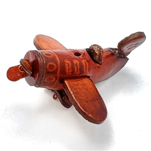 Leather button of a plane with propeller that spins. 
