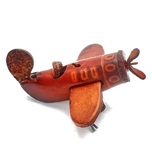 Leather button of a plane with propeller that spins. 