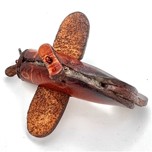 Leather button of a plane with propeller that spins. 