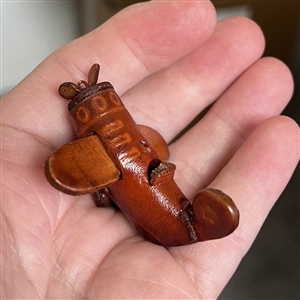 Leather button of a plane with propeller that spins. 