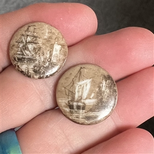 Two 19th c. sepia porcelain buttons of sailing ships.