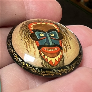 Russian lacquer button of a Lacota (Native American) mask. 