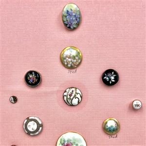 Card of eighteen assorted flower buttons and studs.