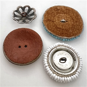 Four Native American buttons. 