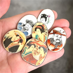 Six Chinese shard ceramic buttons of Asian people.