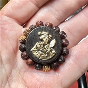 Div I - brass Asian woman on wood button with bone bead border.