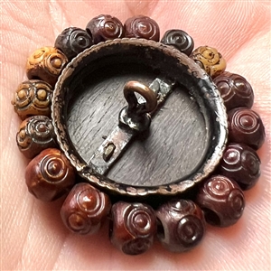 Div I - brass Asian woman on wood button with bone bead border.