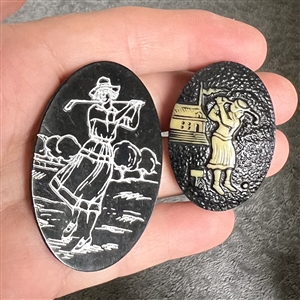 Two celluloid buttons of women golfing. 