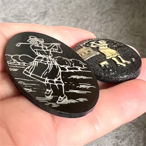 Two celluloid buttons of women golfing. 
