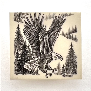Scrimshaw on plastic of a flying eagle by L. Layden.