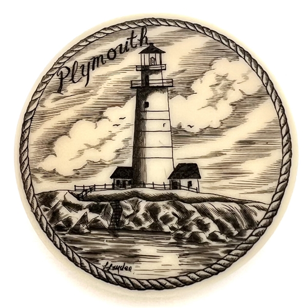 Scrimshaw on plastic of the lighthouse at Plymouth by L. Layden.