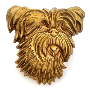 Stamped brass studio button of “Trixie" by Kevin Kinne.
