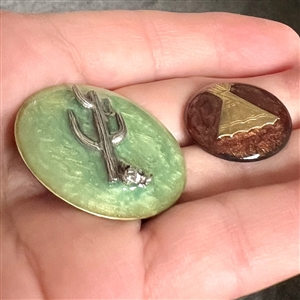 Two cold enamel studio buttons by Kevin Kinne.