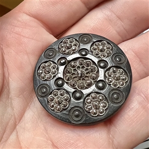 Div I - engine turned dogwood button with faceted steel rosettes.