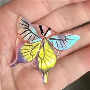 Kay Ferguson fused glass studio button of a butterfly.