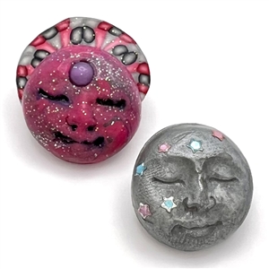 Two fimo sun and moon studio buttons.
