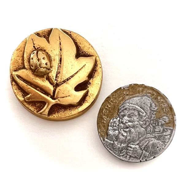 Two cool aluminum buttons.