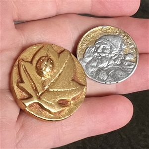 Two cool aluminum buttons.