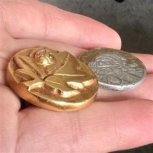 Two cool aluminum buttons.