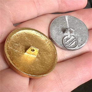 Two cool aluminum buttons.
