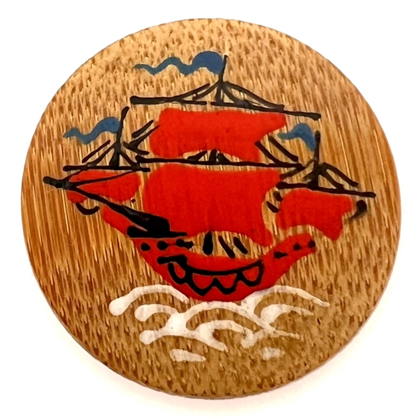 Hand painted wood button of an Asian sailing ship.
