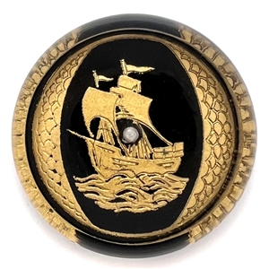 Painted acrylic button of a sailing ship.
