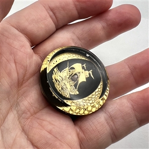 Painted acrylic button of a sailing ship.