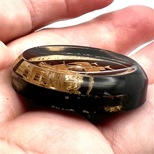 Painted acrylic button of a sailing ship.