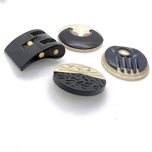Four Vintage casein buttons in black and off white.