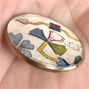 Satin fabric under glass button.