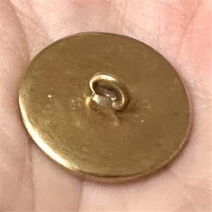 Satin fabric under glass button.