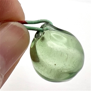 Two green glass buttons.