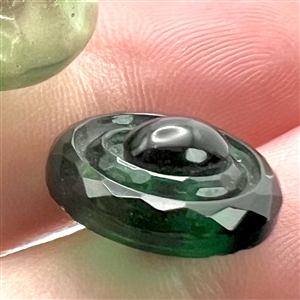Two green glass buttons.