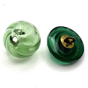 Two green glass buttons.