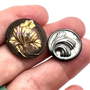Two glass buttons of flowers.