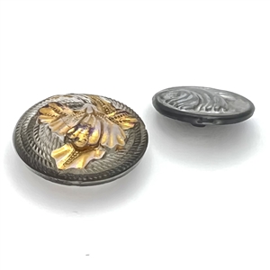 Two glass buttons of flowers.