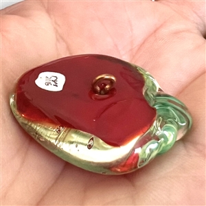 Mary Gaumond's torch-worked glass studio button of a realistic strawberry.